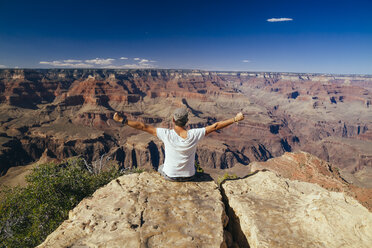 USA, Arizona, man enjoying the view at Grand Canyon, back view - MBEF001081