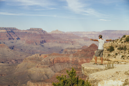 USA, Arizona, man enjoying the view at Grand Canyon - MBEF001087