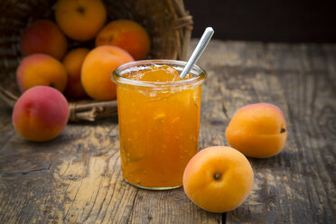Glass of apricots jam and apricots on wood - LVF001538