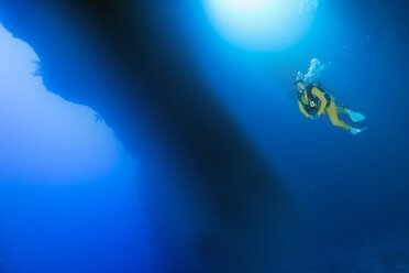 Palau, Pacific Ocean, scuba diver in underwater cave - JWAF000154