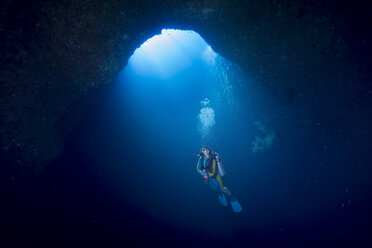 Palau, Pacific Ocean, scuba diver in underwater cave - JWAF000155