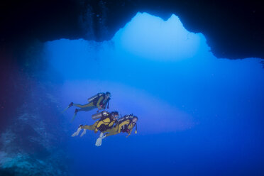 Palau, Pacific Ocean, two scuba divers in underwater cave - JWAF000160