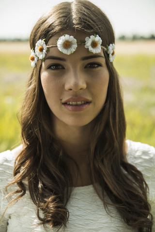 Portrait of young woman wearing floral wreath stock photo
