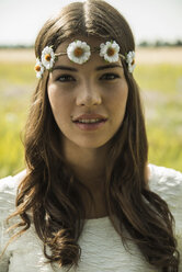 Portrait of young woman wearing floral wreath - UUF001236