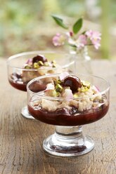 Germany, Cinnamon rice pudding with cherry compote and pistachios - HAWF000385