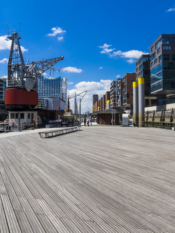 Germany, Hamburg, HafenCity, Magellan-Terrassen, Modern residential and office buildings, Elbe Philharmonic Hall in the background stock photo