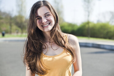 Portrait of happy young woman outdoors - FEXF000108