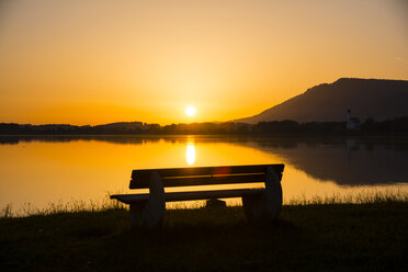 Germany, Bavaria, Allgaeu, East Allgaeu, Lake Forggensee, Bench at sunrise - WGF000337