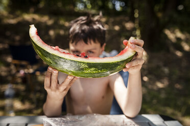 Boy showing leftover of watermelon - SBDF001032