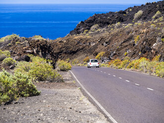 Spain, Canary Islands, La Palma, Faro de Fuencaliente, Country road and car - AMF002583