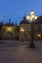 Germany, Lower Saxony, view to entrance portal of Bueckeburg Castle at twilight - PVCF000035