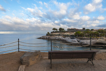 Spain, Canary Islands, Tenerife, Wooden bench at Costa Adeje - RJF000245