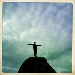 Teenage girl posing on rock - DISF000934