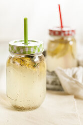 Two screw-top jar of chia fresca, mexican lemonade with chia seeds, Salvia hispanica - SBDF001122