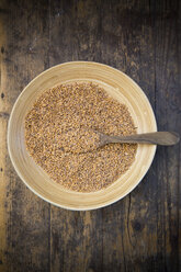 Emmer wheat , Triticum dicoccum, in a bowl, wooden spoon - LVF001692