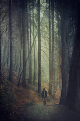 Germany, Solingen, Man on forest path, Textured effect - DWI000134