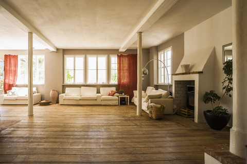 Spacious living room with wooden floor stock photo