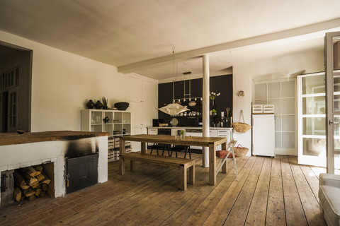 Spacious dining room with wooden floor stock photo