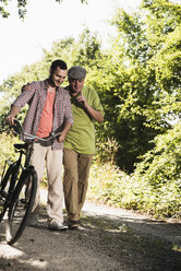 Father and son taking a walk - UUF001533