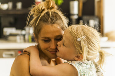 Mother and daughter hugging - TCF004203