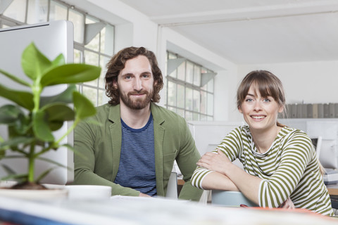 Portrait of two colleagues in a creative office stock photo