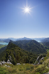 Austria, Upper Austria, Salzburg State, Salzkammergut, View to Lake Mondsee left, Drachenwand, Schafberg and Lake Wolfgangsee against the sun - SIEF005728
