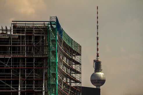 Germany, Berlin, construction site of a buildings with television tower in the background, partial view - BIGF000034