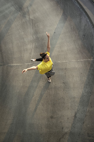 Young ballet dancer exercising on a parking level stock photo