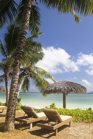 Seychelles, La Digue Island View of the beach Anse La Reunion and sun loungers stock photo