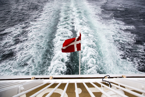 Denmark, Danish flag on ferry on the sea stock photo