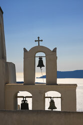 Greece, Cyclades, Santorini, view to bell tower of a church in front of the sea - KRPF000844