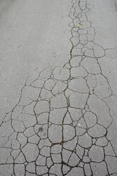 Germany, Bavaria, Cracked asphalt street - AXF000711