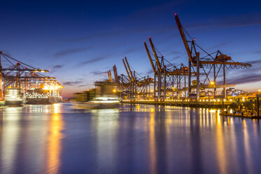 Germany, Hamburg, Port of Hamburg, Container Terminal, container cranes and container ships in the evening - NK000173