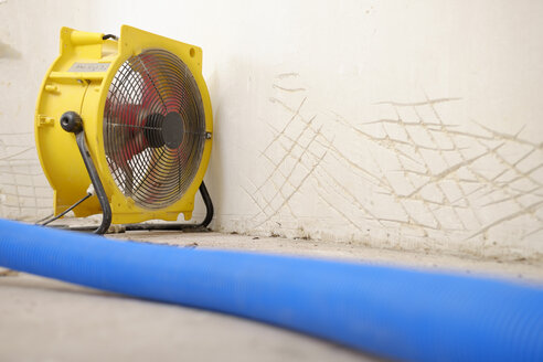 Dehumidifier at work in an apartment which is damaged by flooding - LAF001023