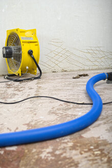 Dehumidifier at work in an apartment which is damaged by flooding - LAF001025