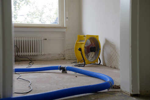 Dehumidifier at work in an apartment which is damaged by flooding - LAF001029