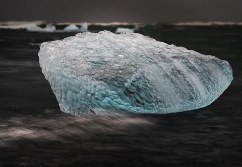 Iceland, Joekulsarlon, Ice block in surf stock photo