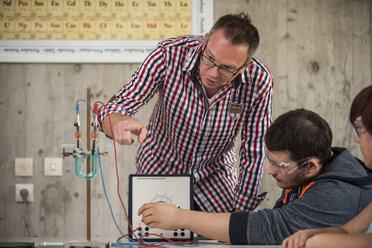 Vocational school student and teacher in chemistry class - PAF000773