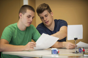 Two vocational school students in class room discussing - PAF000784