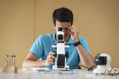 Vocational school student using optician device - PAF000793