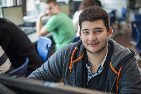 Portrait of vocational school student in computer lab - PAF000812