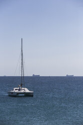 Spain, Andalusia, Strait of Gibraltar, cargo ships and a catamaran in the bay of Tarifa - KBF000135