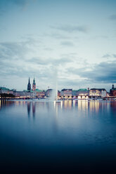 Germany, Hamburg, Inner Alster and Alster fountain in the evening - KRPF001018