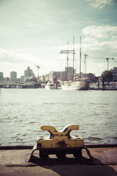 Germany, Hamburg, Port of Hamburg, Elbe river, Bollard against the sun - KRPF001008