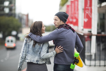 Young couple walking arm in arm on the street - ZEF000052