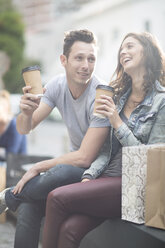 Young couple relaxing with coffee to go - ZEF000016