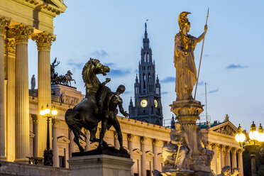 Austria, Vienna, view to parliament building, town hall tower and statue of goddess Pallas Athene by twilight - EJWF000531