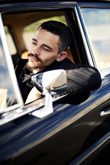 Young man inside vintage car - VRF000112