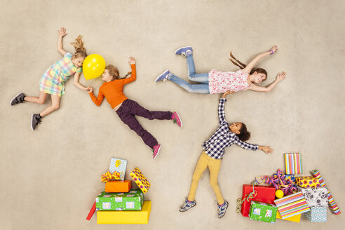 Children with heaps of birthday presents - BAEF000975