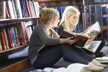 Two female students learning in a library - ZEF000101